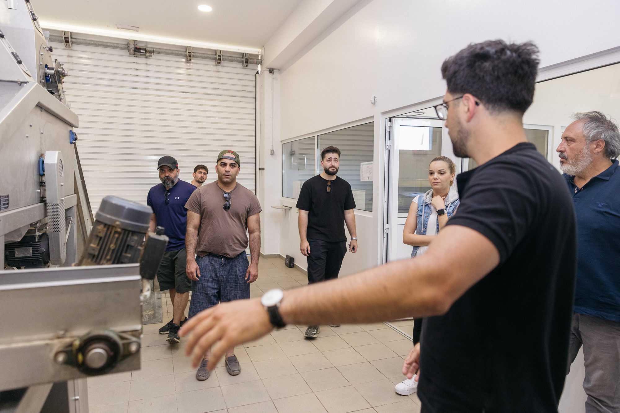 Touring the cold-press mill in Crete with the production team