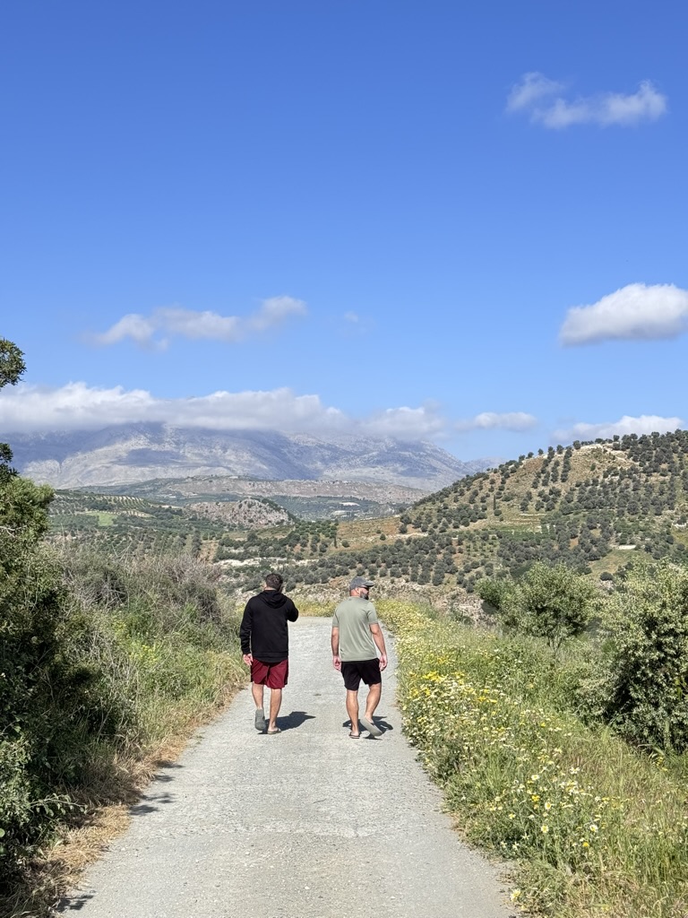 Founders walking the olive grove road — Chania, Crete